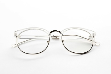 Photo of Glasses with corrective lenses on white background. Vision problem