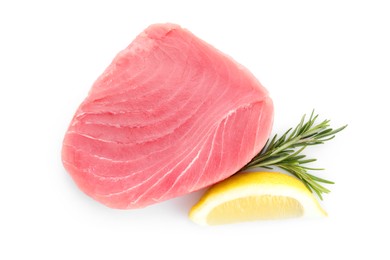 Photo of Raw tuna fillet, lemon wedge and rosemary on white background, top view