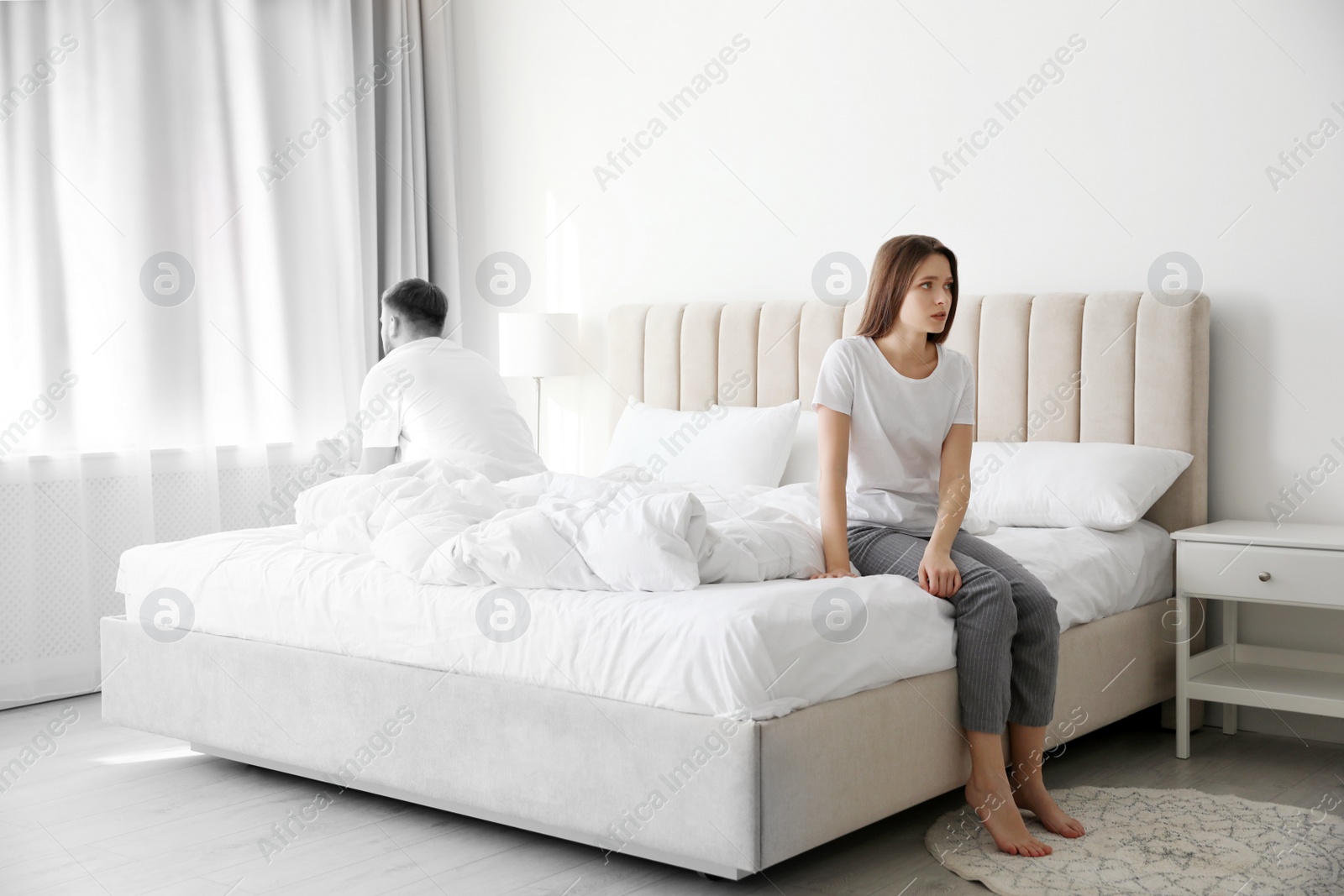Image of Unhappy young couple with relationship problems at home. Cheating and breakup