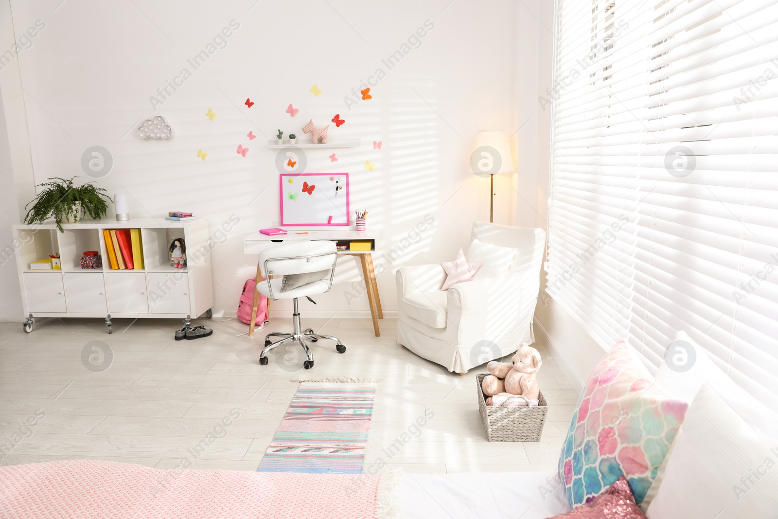 Photo of Modern child room interior with stylish furniture