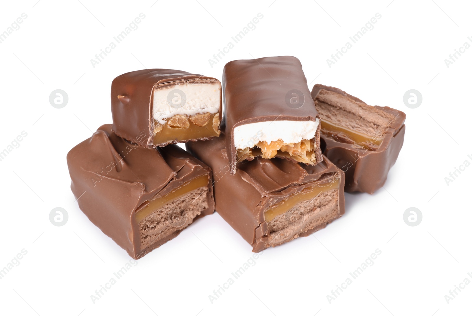 Photo of Pieces of tasty chocolate bars with nougat and nuts on white background