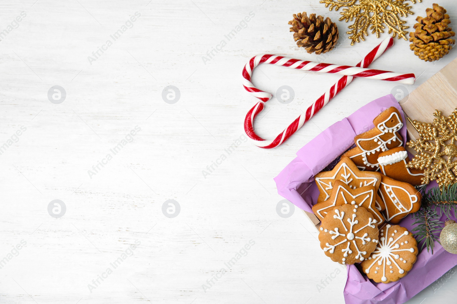 Photo of Crate with tasty homemade Christmas cookies on table, top view