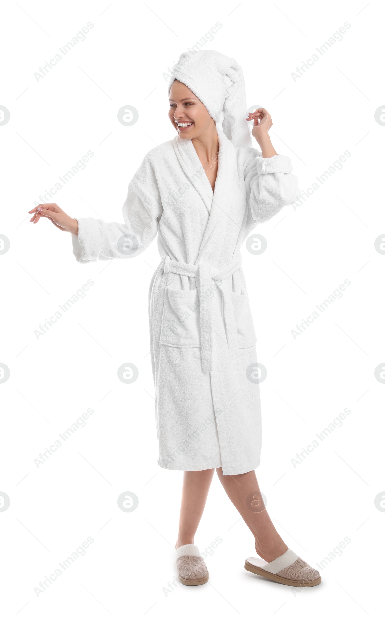 Photo of Young woman in bathrobe on white background