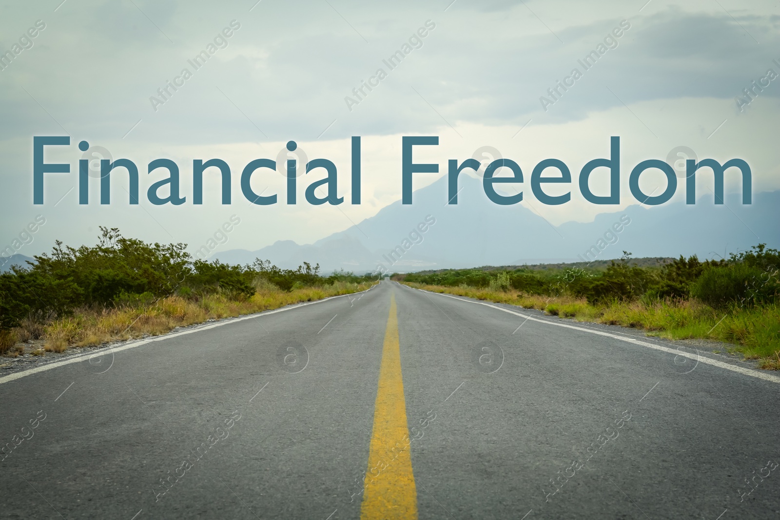 Image of Way to financial freedom. Words over asphalt road