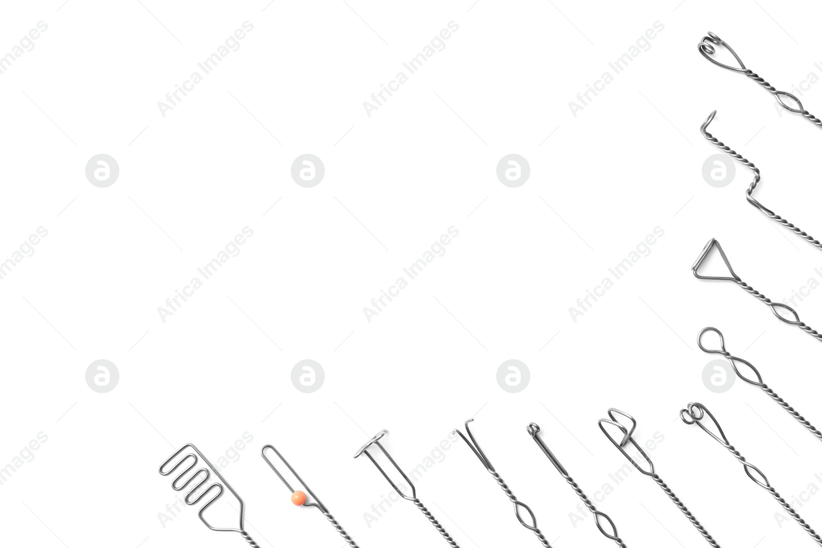 Photo of Set of logopedic probes on white background, top view. Speech therapist's tools