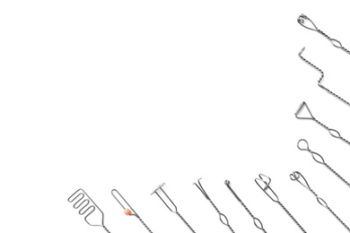 Photo of Set of logopedic probes on white background, top view. Speech therapist's tools