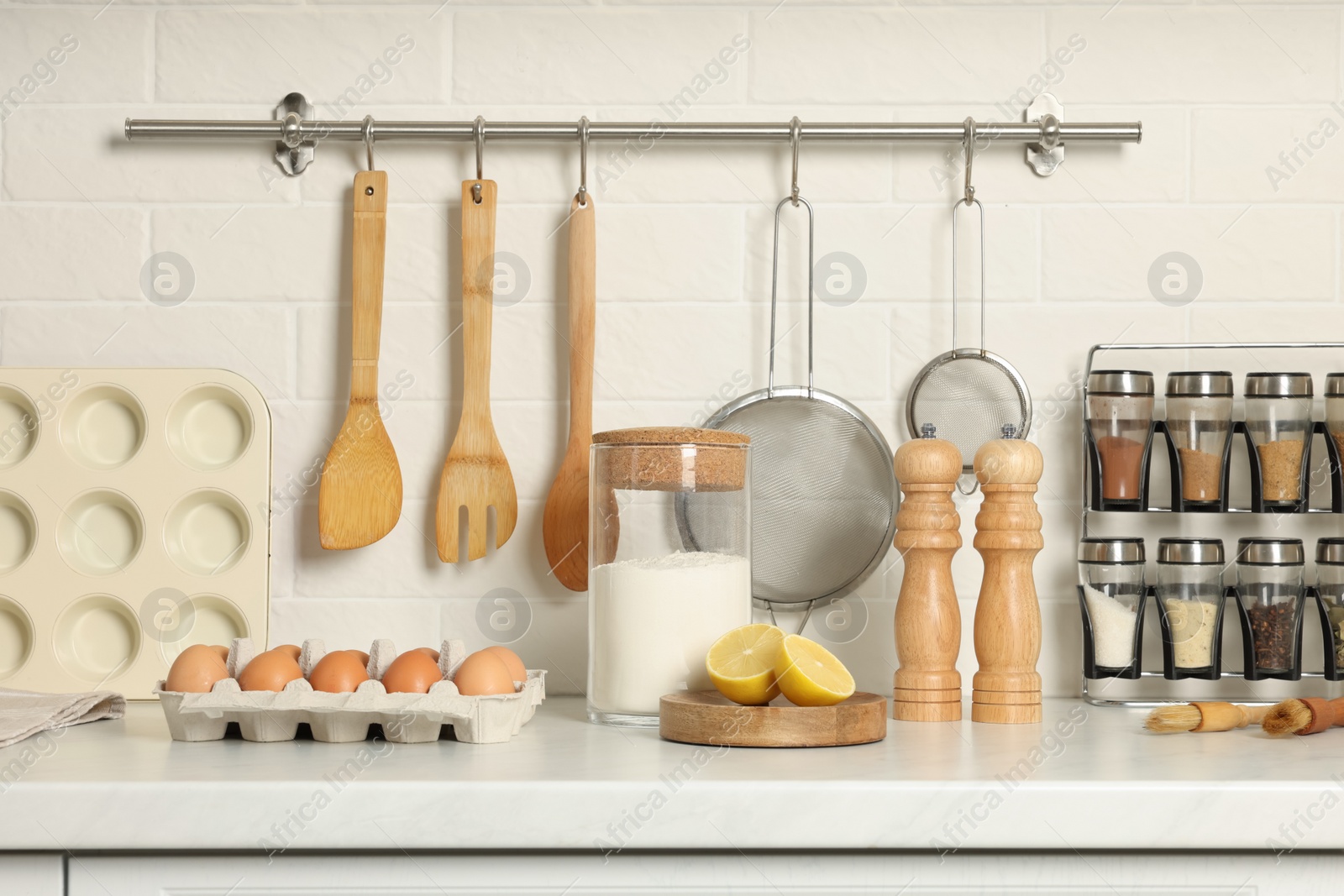 Photo of Countertop with cooking utensils and products in kitchen