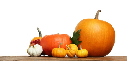 Photo of Happy Thanksgiving day. Composition with pumpkins and berries on wooden table against white background. Space for text