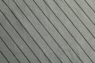 Photo of Texture of grey striped fabric as background, closeup