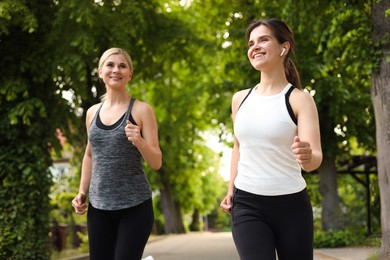 Photo of Women running on city street in morning