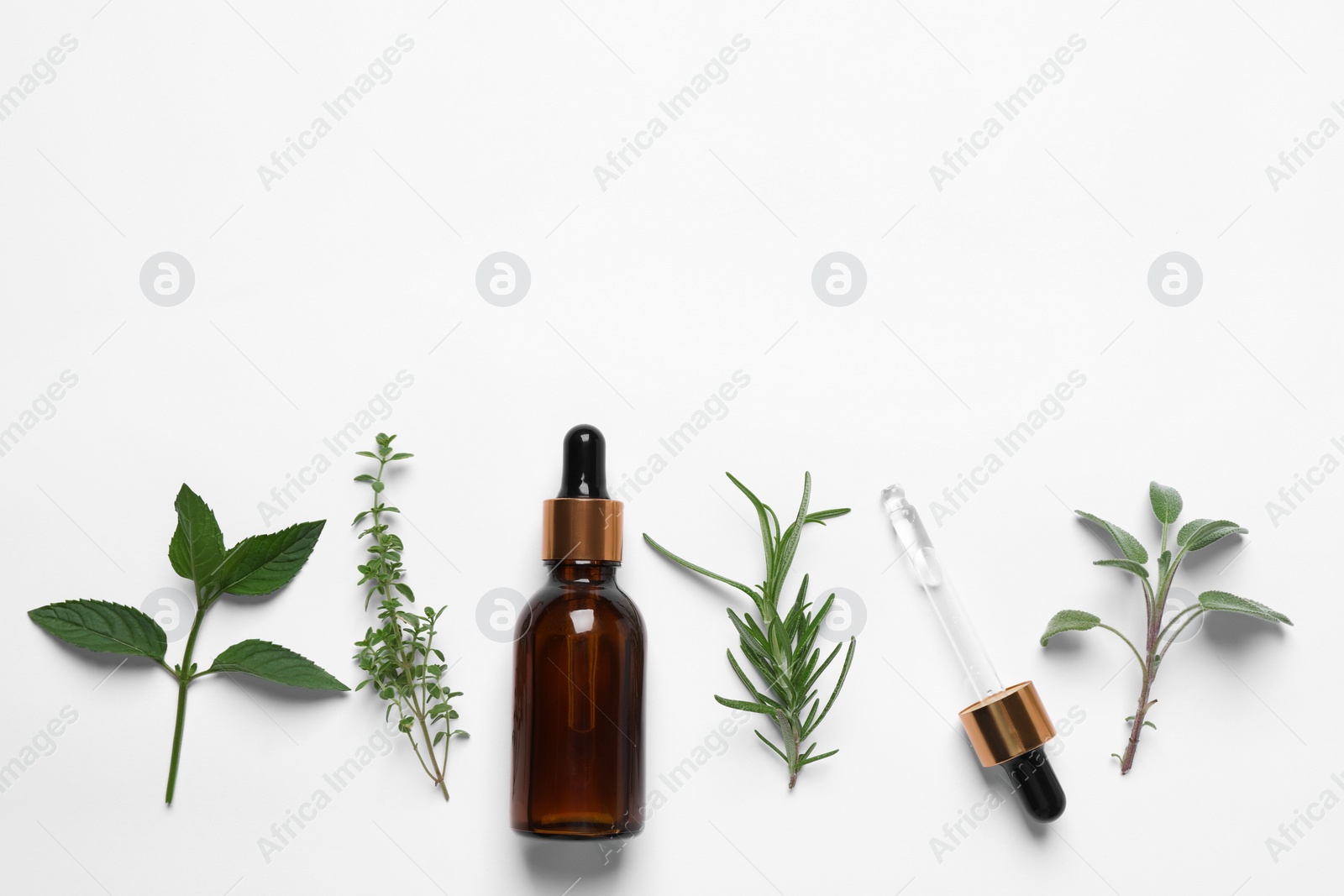 Photo of Bottle of essential oil, pipette and different herbs on white background, flat lay. Space for text