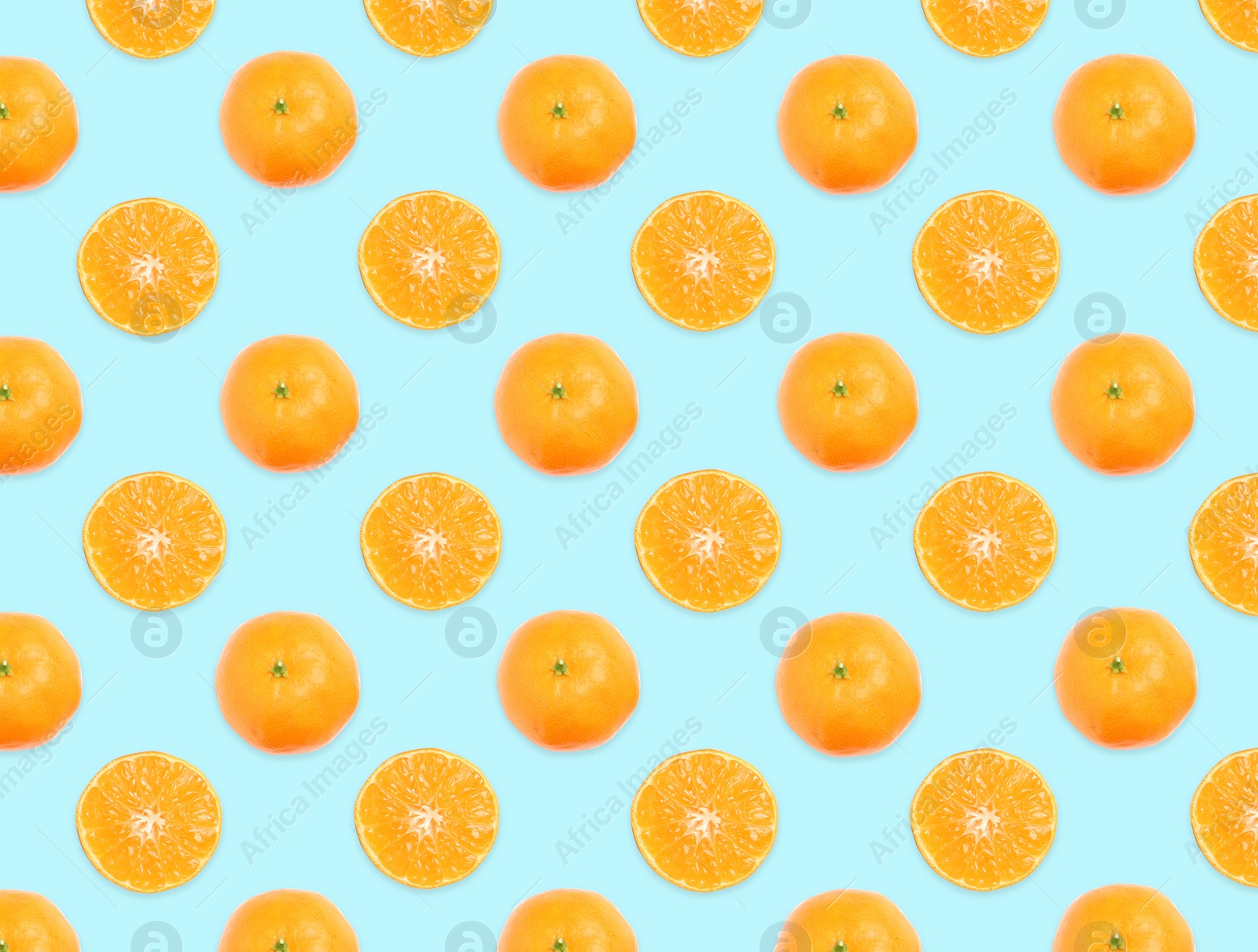 Image of Pattern of whole and halved tangerines on light blue background