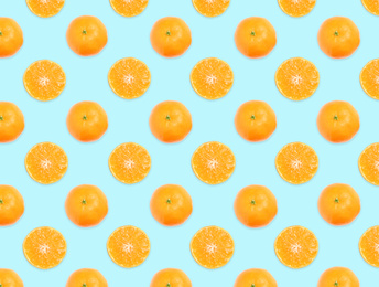 Image of Pattern of whole and halved tangerines on light blue background