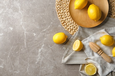 Flat lay composition with lemons on color background