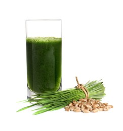 Photo of Glass of fresh wheat grass juice, seeds and sprouts on white background