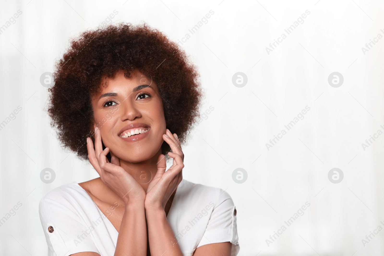 Photo of Portrait of beautiful young woman on light background. Space for text