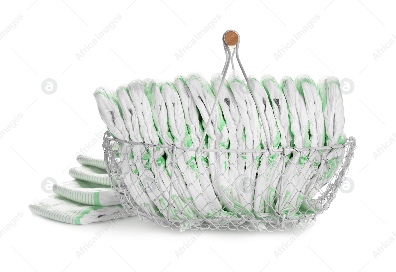 Photo of Basket and disposable diapers on white background. Baby accessories