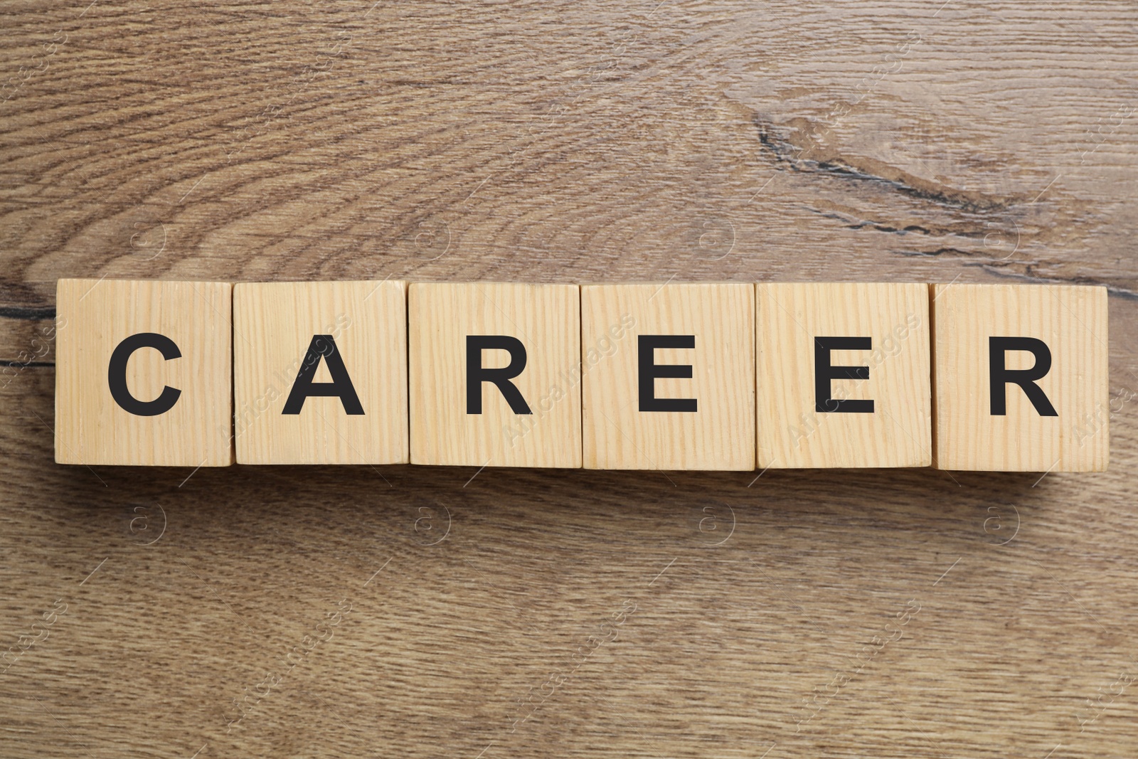 Photo of Cubes with word CAREER on wooden background, flat lay