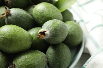 Fresh green feijoa fruits in bowl, closeup