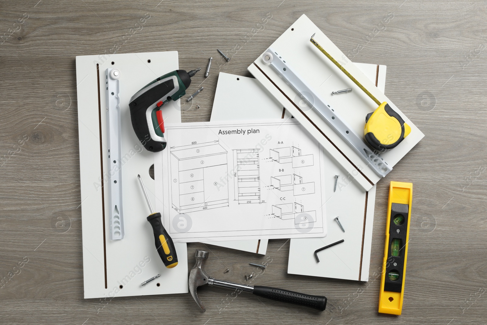 Photo of Flat lay composition with furniture parts and tools for self-assembly on wooden background