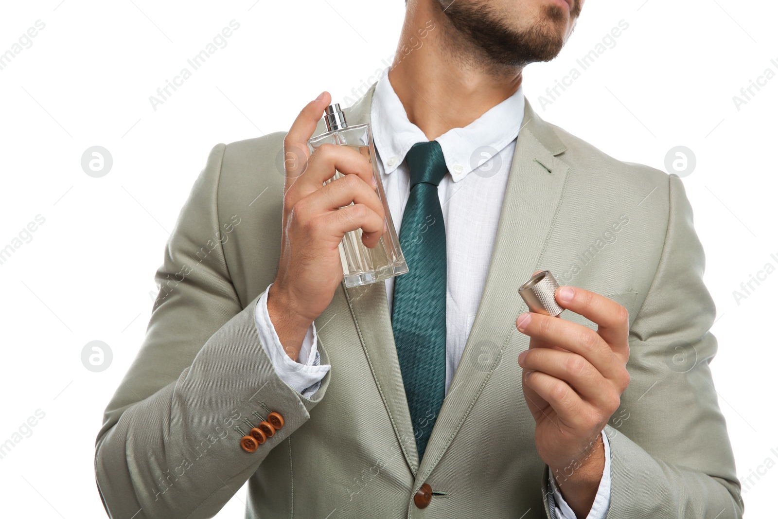 Photo of Businessman applying perfume on white background, closeup