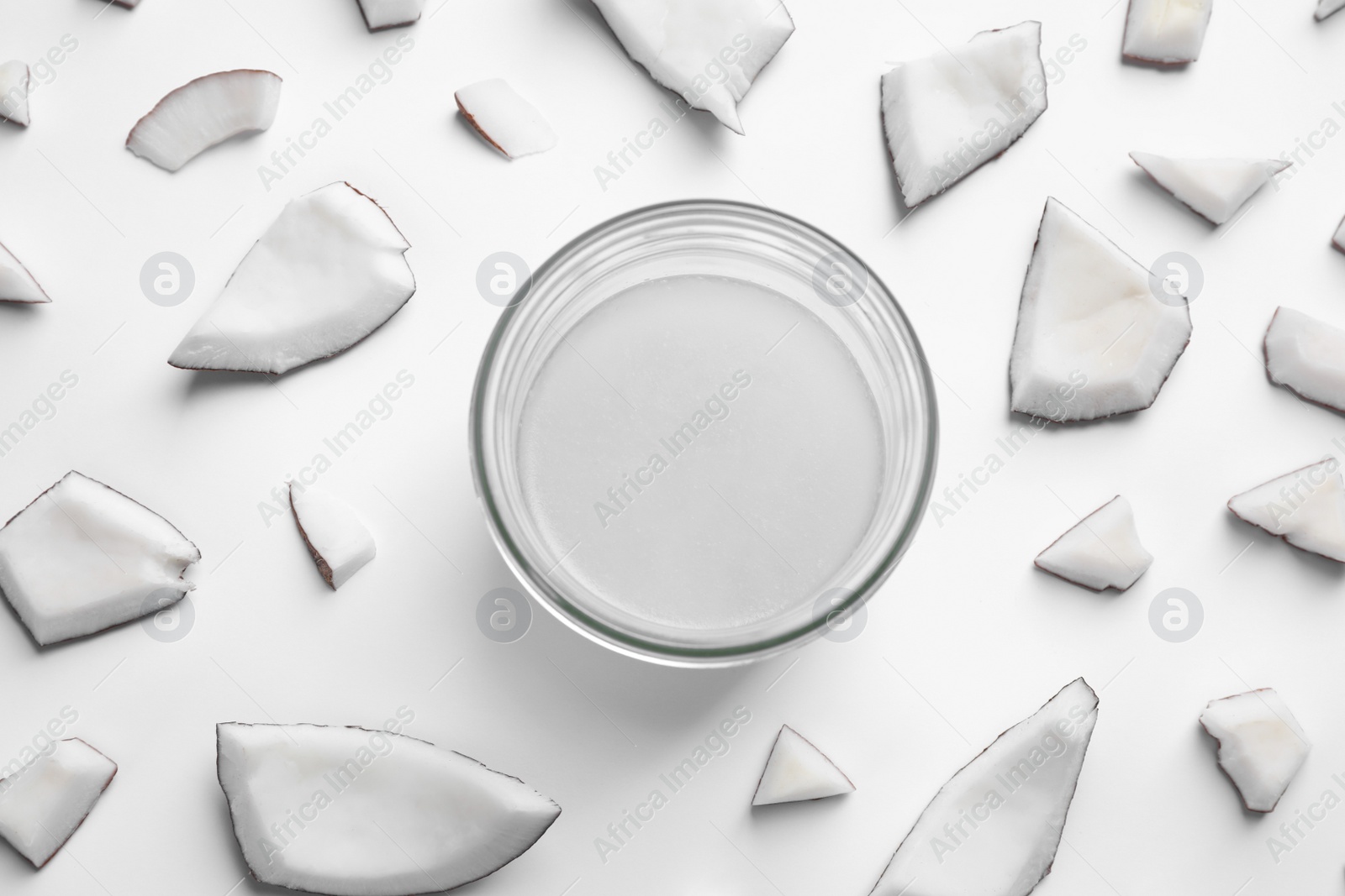 Photo of Composition with coconut oil on white background, top view