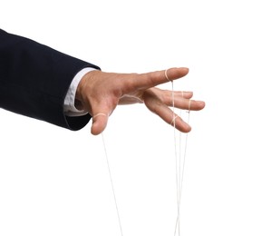 Photo of Man pulling strings of puppet on white background, closeup