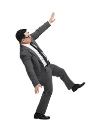 Businessman in suit posing on white background