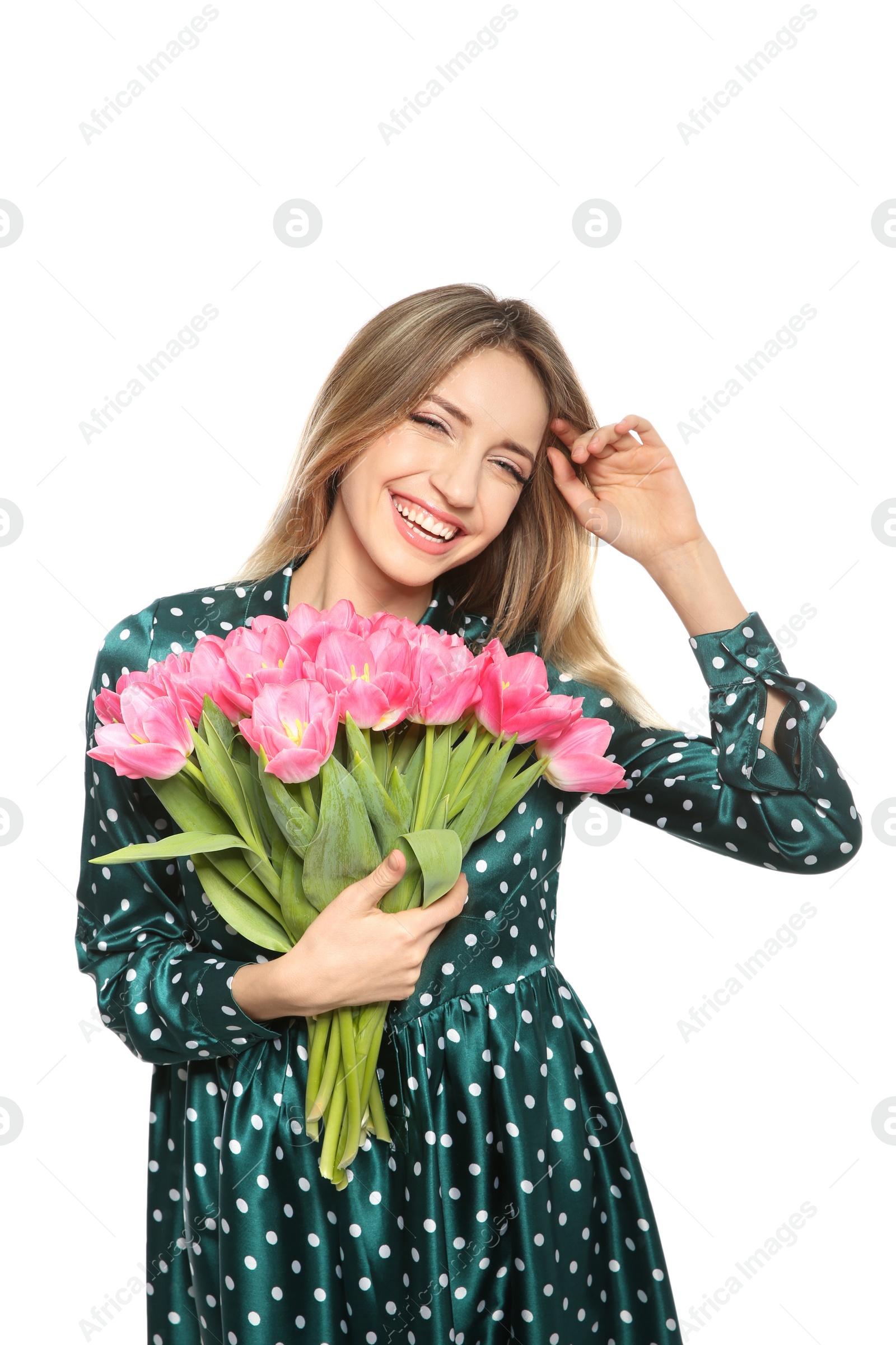 Photo of Portrait of smiling young girl with beautiful tulips on white background. International Women's Day