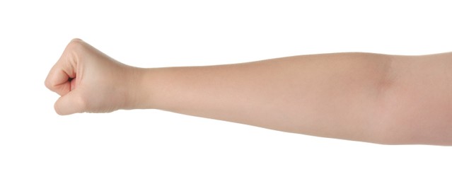 Playing rock, paper and scissors. Woman showing fist on white background, closeup