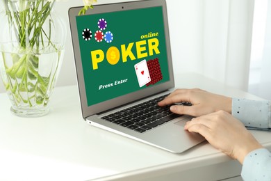 Woman playing poker on laptop at home, closeup. Casino online