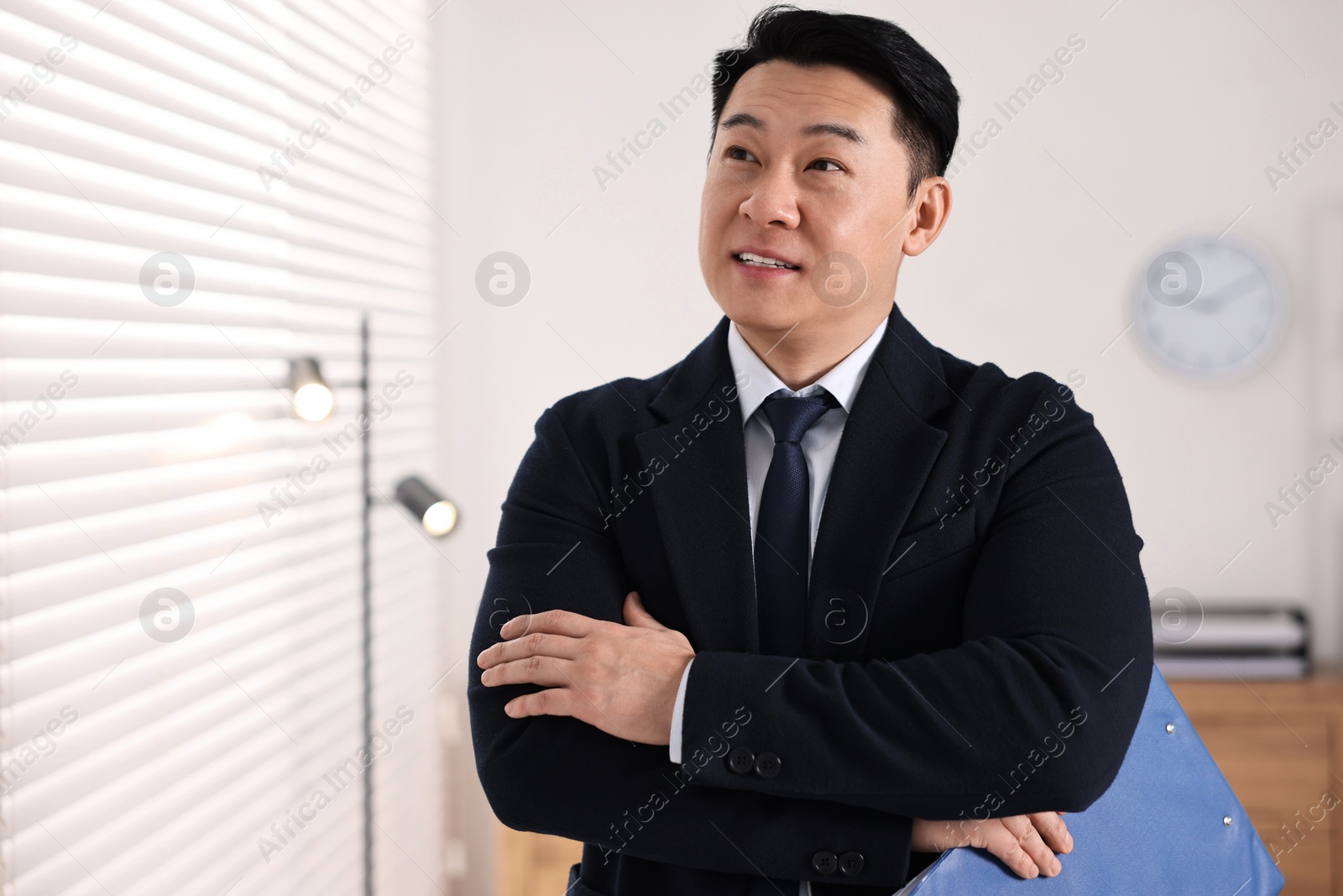 Photo of Portrait of happy notary with clipboard in office, space for text