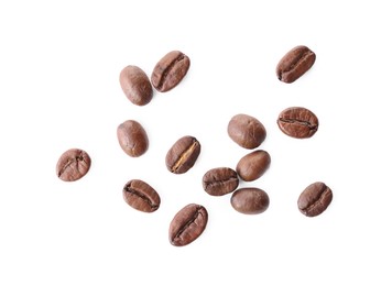 Many roasted coffee beans isolated on white, top view