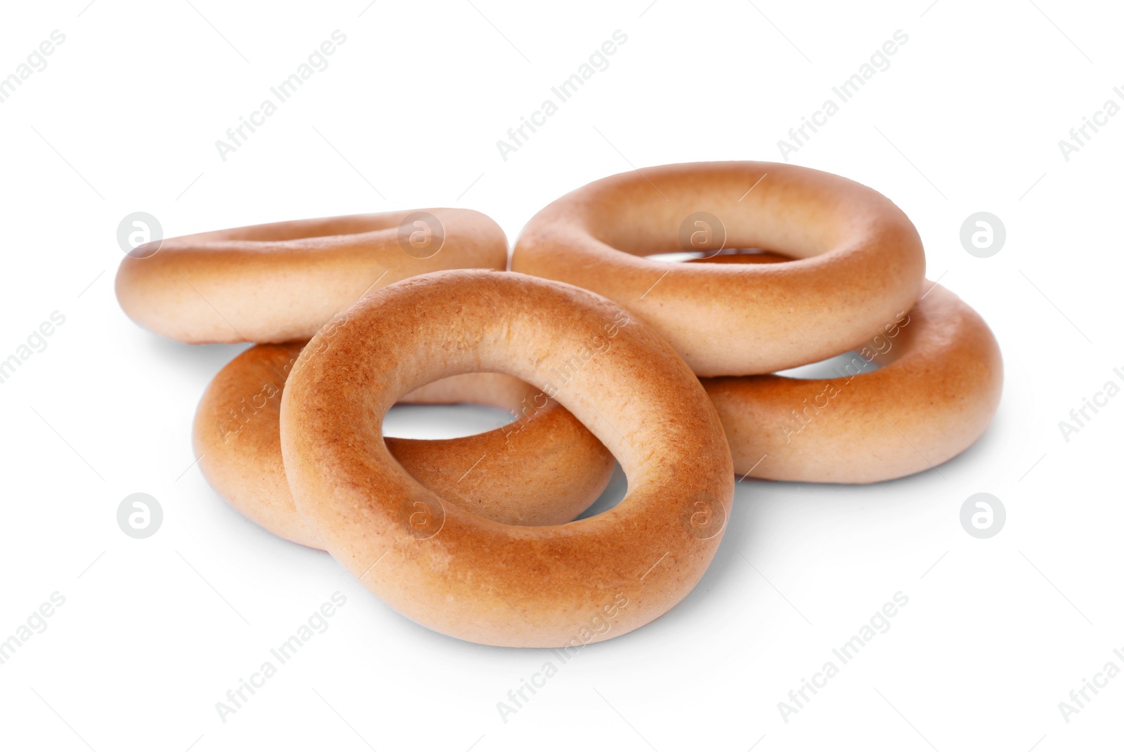 Photo of Tasty dry bagels (sushki) isolated on white