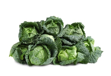 Pile of fresh savoy cabbages on white background