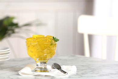 Photo of Dessert bowl of jelly served on table. Space for text