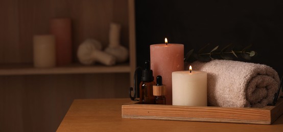 Beautiful composition with different spa products on wooden table indoors, space for text