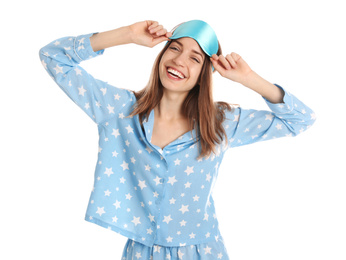 Photo of Beautiful woman wearing pajamas and sleep mask on white background. Bedtime