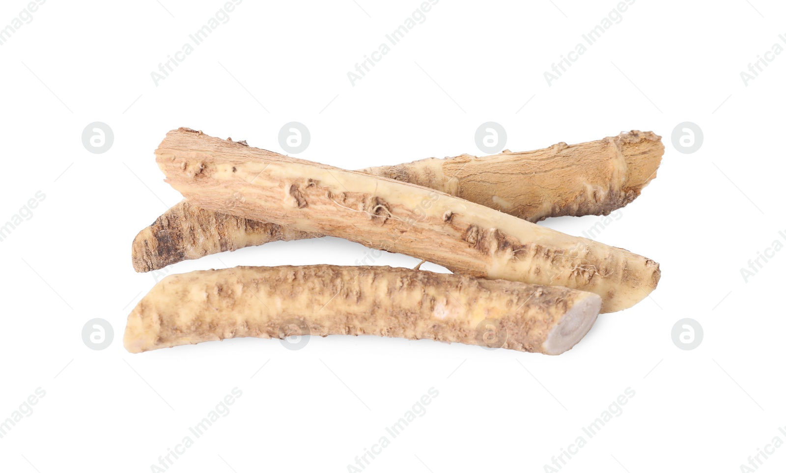 Photo of Fresh cut horseradish roots isolated on white, top view