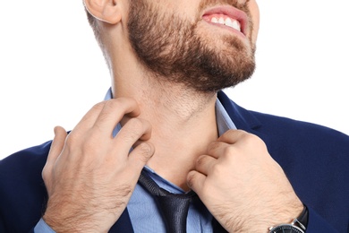 Photo of Young man scratching neck on white background, closeup. Annoying itch