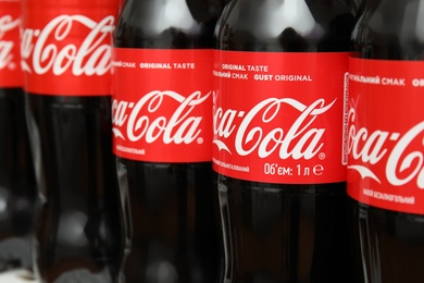 Photo of MYKOLAIV, UKRAINE - NOVEMBER 14, 2018: Many bottles of Coca-Cola on display in store