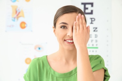 Photo of Young woman visiting ophthalmologist