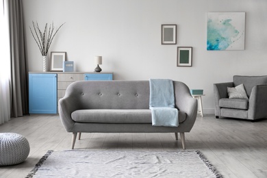 Photo of Cozy living room interior with comfortable sofa