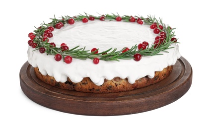 Photo of Traditional Christmas cake decorated with rosemary and cranberries isolated on white