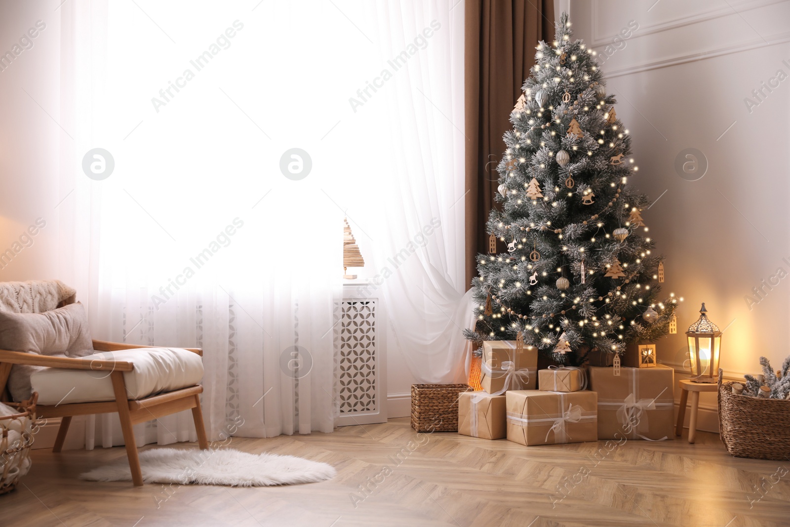 Photo of Beautiful living room interior with decorated Christmas tree and gifts