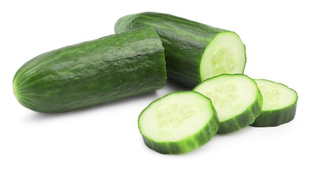 Photo of Halves and slices of long cucumber isolated on white