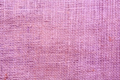 Image of Texture of pink burlap fabric as background, top view