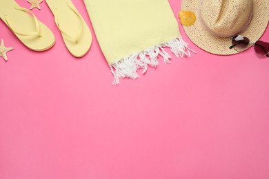 Photo of Flat lay composition with different beach objects on pink background, space for text