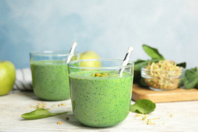 Photo of Green buckwheat smoothie on white wooden table
