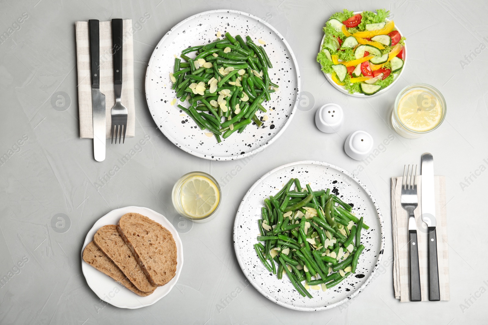 Photo of Tasty green beans with almonds served for dinner on table, top view